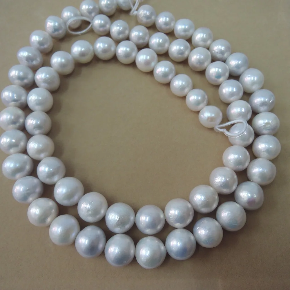 40 cm, saldūdens pērļu materiāls, ar apaļas formas -daba balta krāsa-12-15 mm, ideāli apaļas pērles Attēls 1